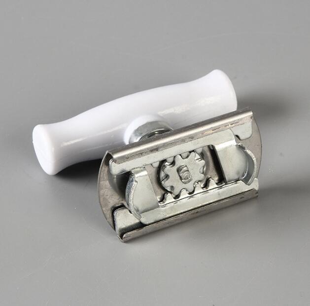 Metal razor with white handle on a gray background