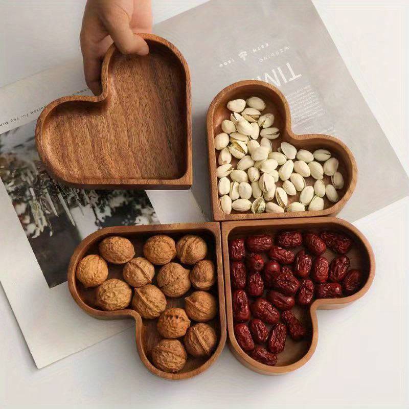 Heart-shaped serving tray set displayed with fruits and snacks