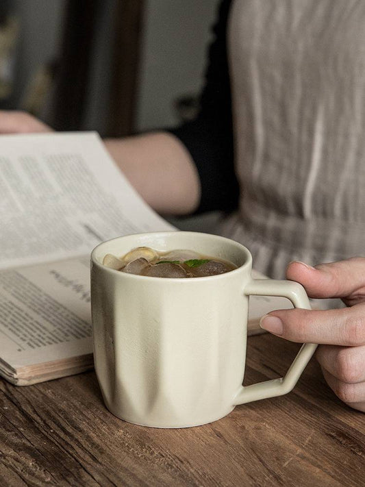 Milky white diamond-pattern mug close-up