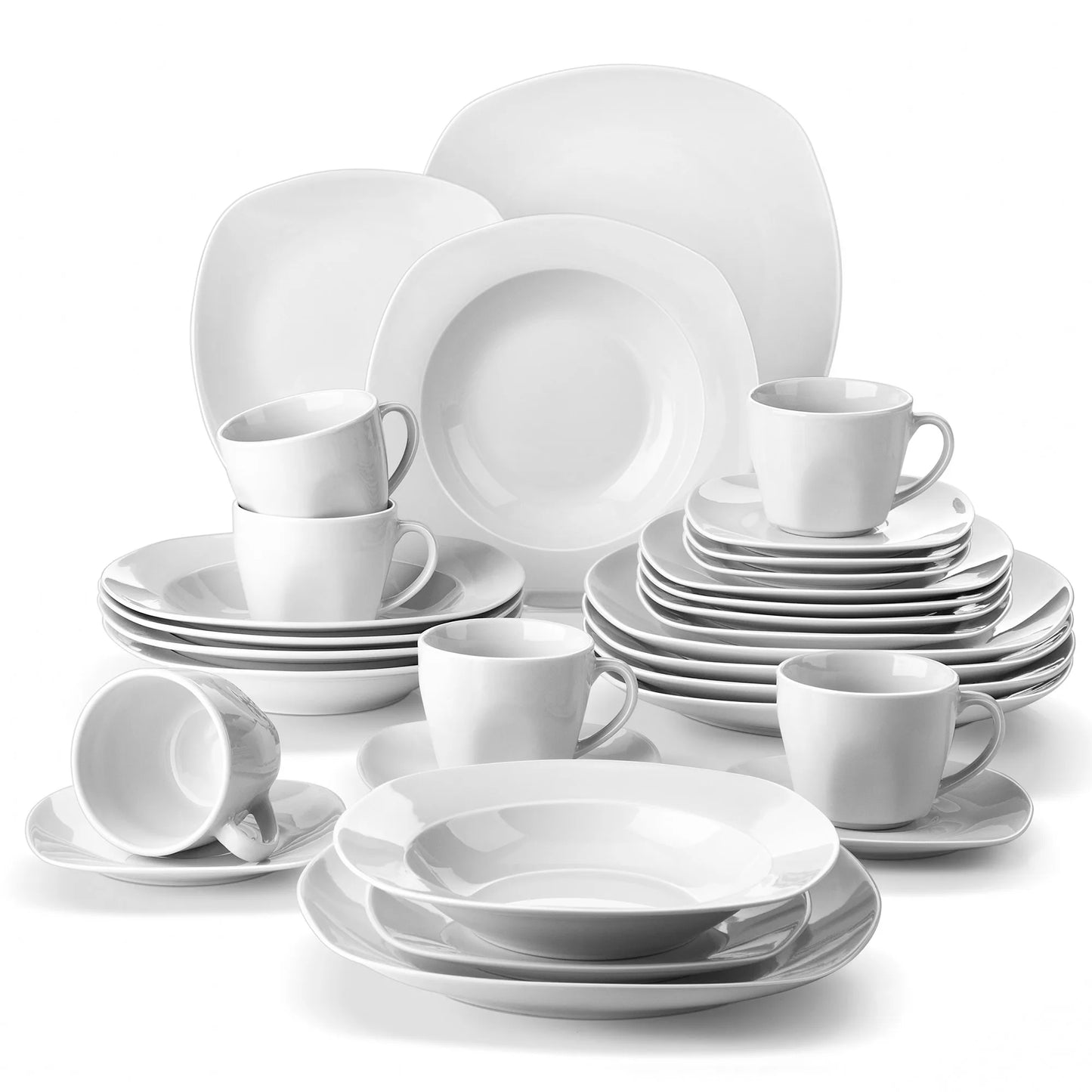 Set of white ceramic dinnerware including plates, bowls, and cups on a white background