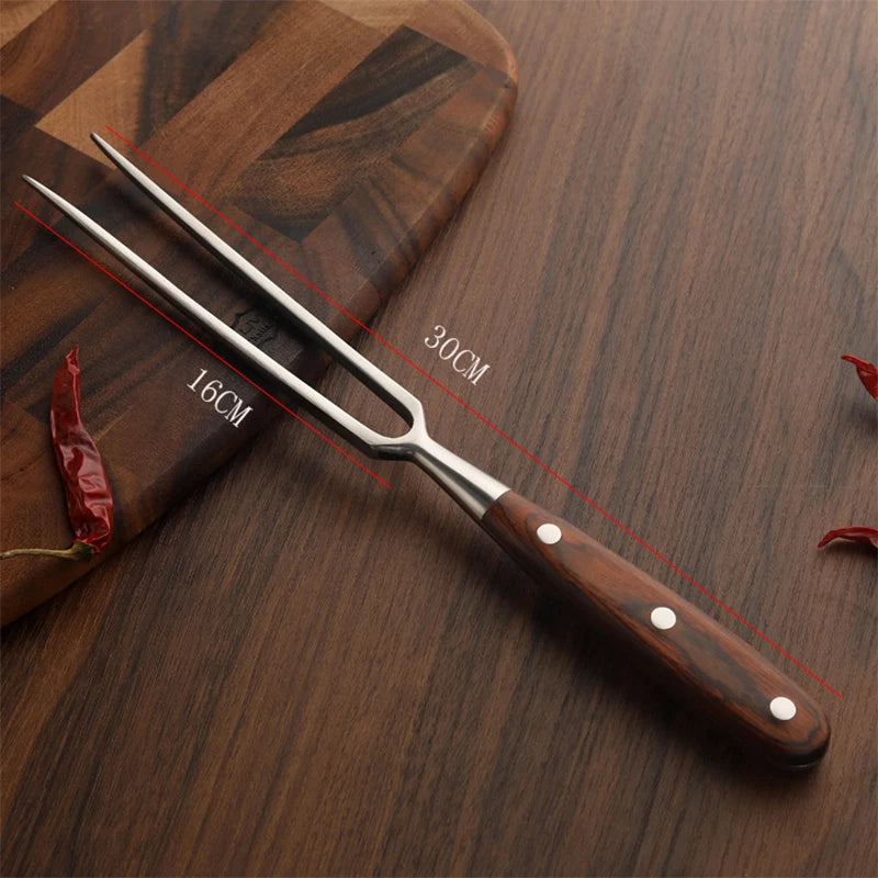 Long forged steel barbecue fork, skewering a large cut of meat.