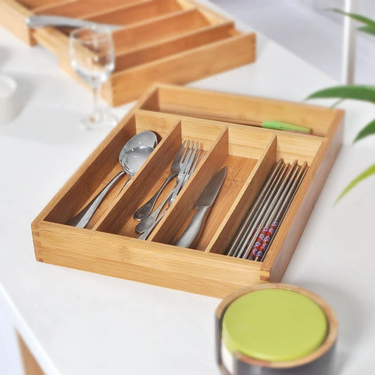 Bamboo drawer organizer keeping kitchen gadgets neatly organized.