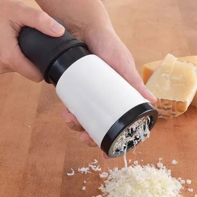 Versatile 2-blade grating and grinding tool, grinding fresh herbs.