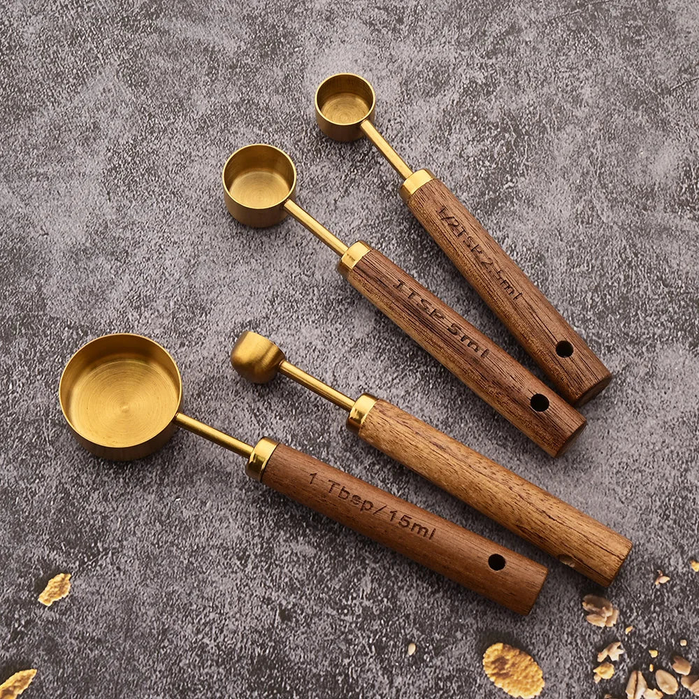 Premium gold measuring cups, luxurious gold finish and ergonomic wooden handle.
