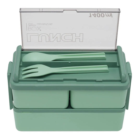 Green lunch box with compartments and utensils on a white background