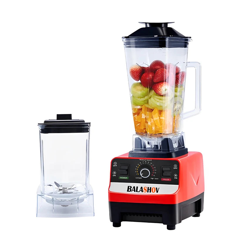 Blender with fruits inside on a white background, featuring the brand 'Balashov'.