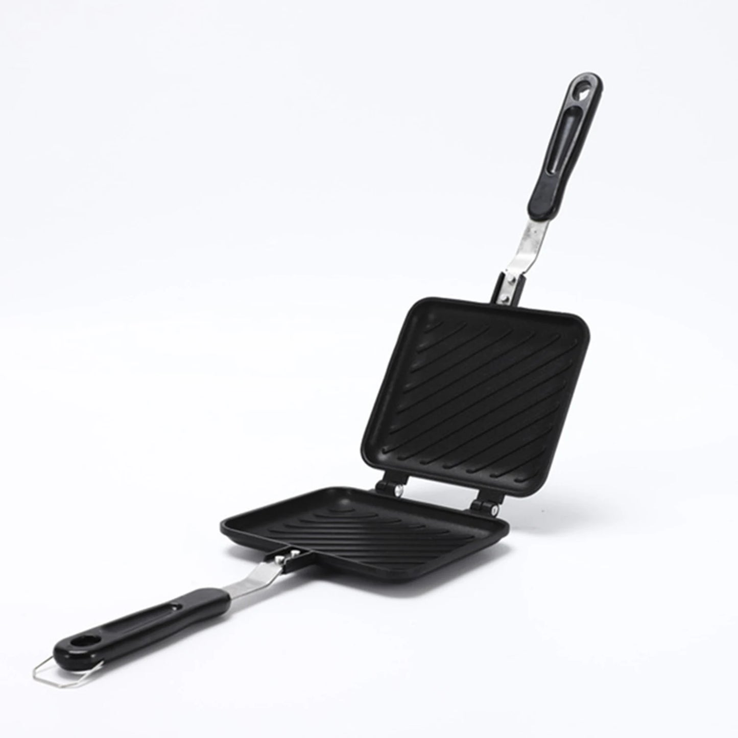 Black double-sided grill pan with two distinct cooking surfaces on a white background