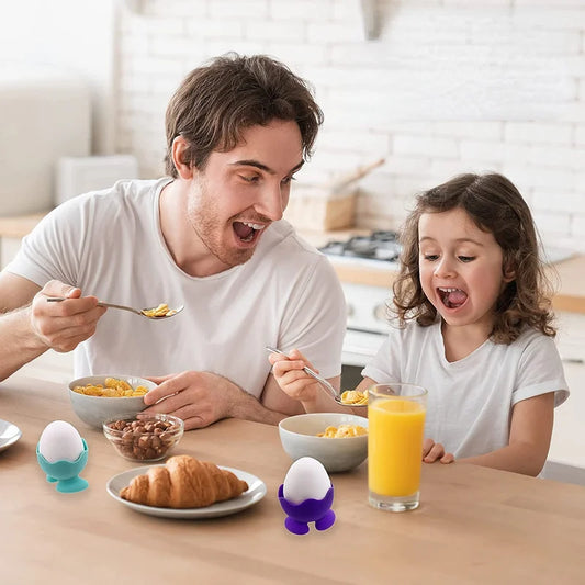 Kids using colourful silicone egg cups.