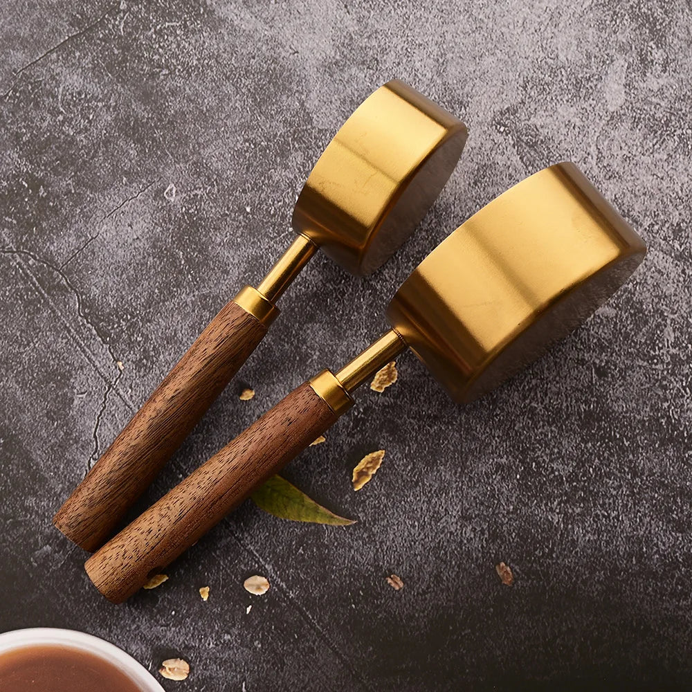 Ergonomic kitchen measuring set gold, professional stainless steel construction.
