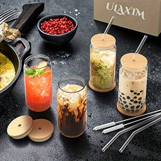 Reusable glass drinkware set with eco-friendly bamboo lids and glass straws