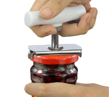 Person using a jar opener to open a jar with a white background