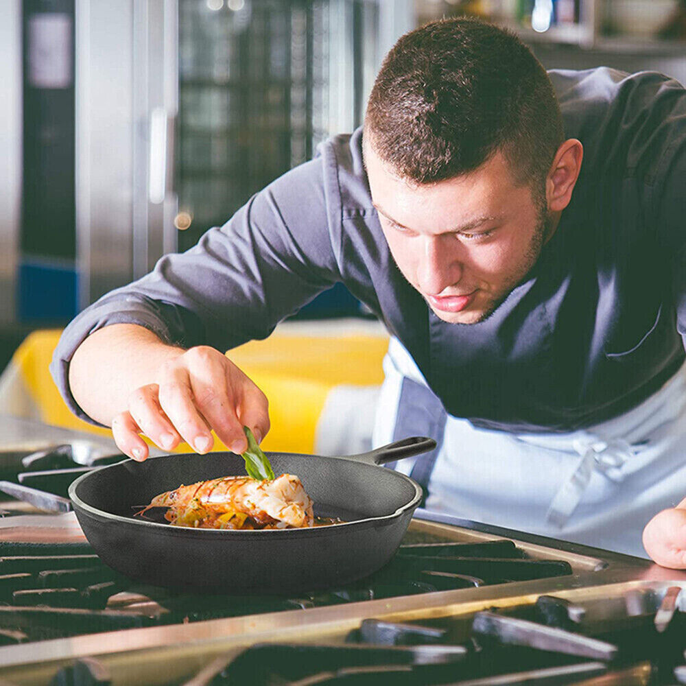 Chef preparing a dish in a kitchen