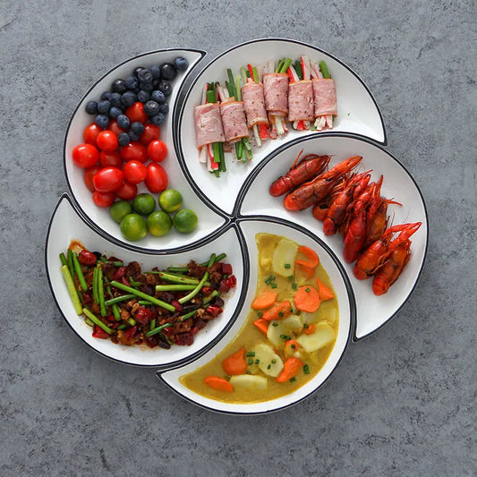 The complete Flower Moon Plate Set arranged as a flower on a dining table.