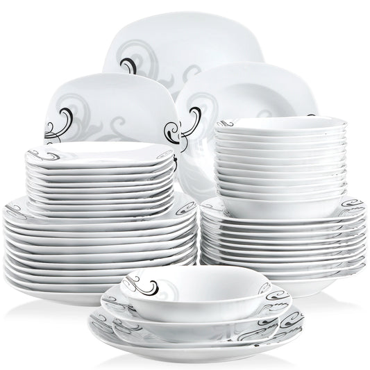 Set of white ceramic dinnerware with decorative patterns on a white background