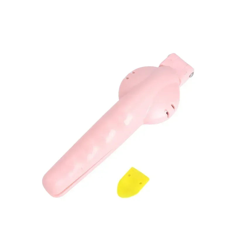 Pink ergonomic nut opener in kitchen setting.