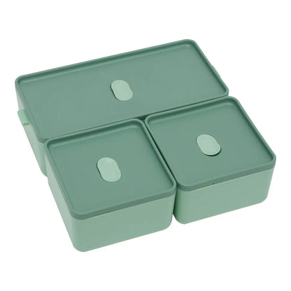 Set of three green storage containers with lids on a white background