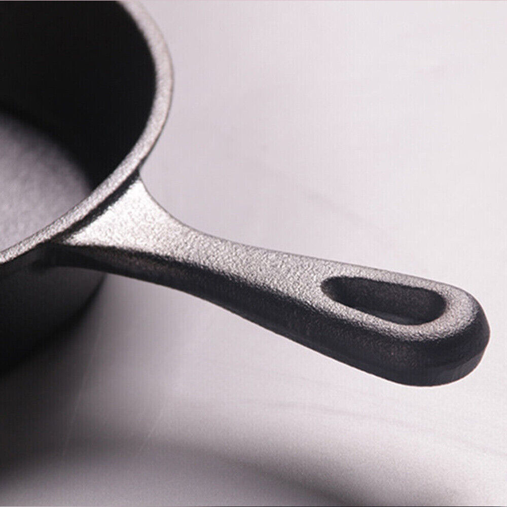 Close-up of a cast iron skillet on a light gray background